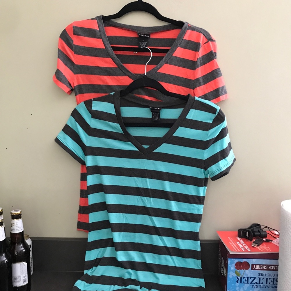 A grey and pink shirt, grey and blue shirt